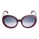 Elsa Lee Paris sunglasses, round frame made of semi-transparent sparkling fuchsia plastic, with a gold tone symbol on the temple