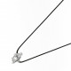 Collier Elsa Lee Paris en argent 925, motif pinguin recouvert d'oxydes de Zirconium, sur cordon ciré noir.