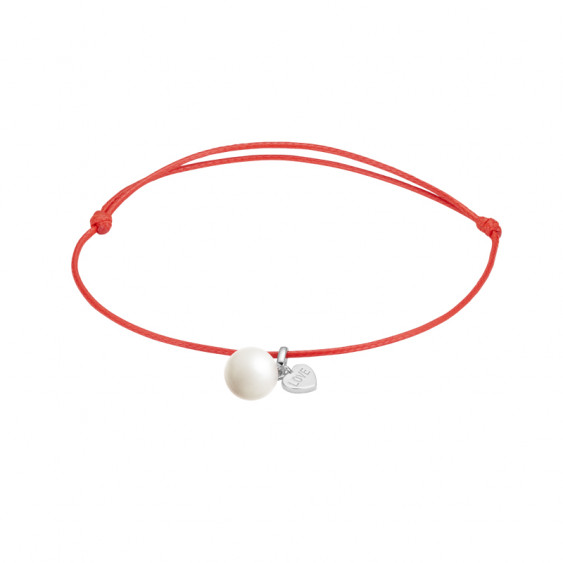 Clear Spirit Elsa Lee bracelet, white pearl on red cord