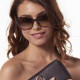 Elsa Lee Paris sunglasses, with a modern brown frame and transparent stripes