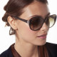 Elsa Lee Paris sunglasses, with a modern brown frame and transparent stripes