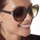 Elsa Lee Paris sunglasses, with a modern brown frame and transparent stripes