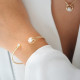 White pearl and yellow gold bangle in semi-open shape by Elsa Lee 