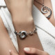 Circle Bracelet in silver with its ring chain by Elsa Lee