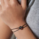 Black cotton cord bracelet and silver kiss locket bisous