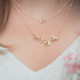 Gilded silver Laurel leaves necklace on golden double chain by Elsa Lee Paris 