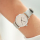 Thin silver watch with its stainless steel milanese mesh bracelet interchangeable