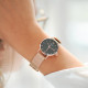 Thin Rose gold watch with black dial and milanese mesh bracelet by Elsa Lee Paris