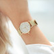 Thin gold metal bracelet watch with white dial and milanese mesh bracelet by Elsa Lee Paris 
