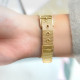 Thin gold metal bracelet watch with white dial and milanese mesh bracelet by Elsa Lee Paris 