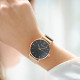 Rose gold metal bracelet watch with black dial and simple design