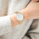 Watch with white dial adorned with geometrical design with a Milanese mesh bracelet in golden and a free leather bracelet