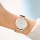 Rose gold geometrical design watch with white dial and rose gold milanese mesh bracelet 