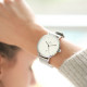 Silver watch with clean style white dial featuring a date function, silver milanese mesh interchangeable bracelet