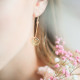 Boucles d'oreilles Arbre de Vie pendantes en argent plaqué or jaune par Elsa Lee Paris 