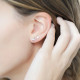 Boucles d'oreilles puces Elsa Lee Paris, collection tendance, motif croix avec oxydes de Zirconium