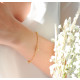 Simple design golden bracelet with intertwined golden rings in silver by Elsa Lee Paris